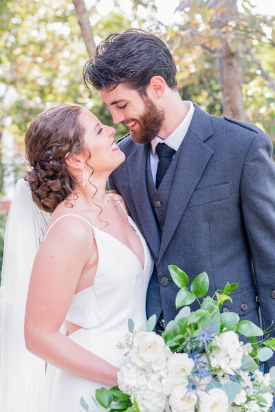 Bride and groom on Virginia wedding day with wedding florals