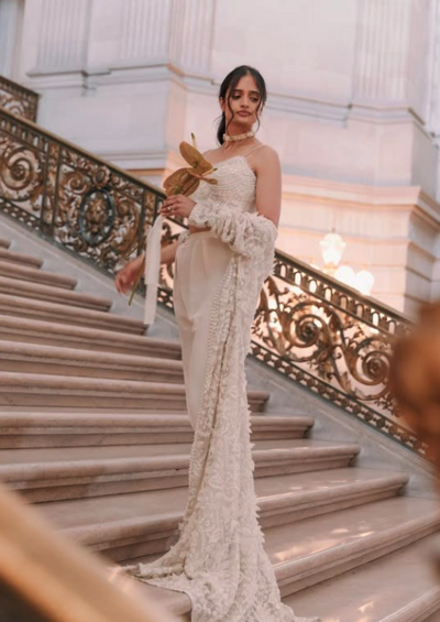 Bride smiling with polished updo and radiant skin
