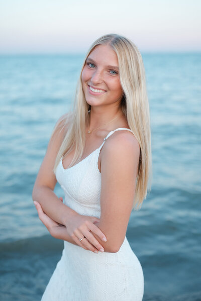 Senior girl headshot taken at the beach during golden hour.