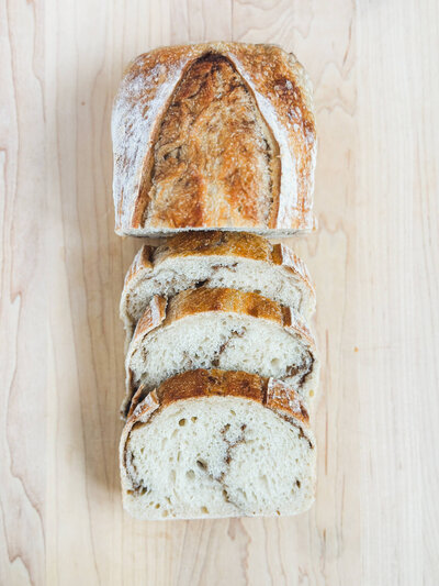 Artfully sliced cinnamon swirl bread representing handcrafted bakery goods made in our cottage kitchen.