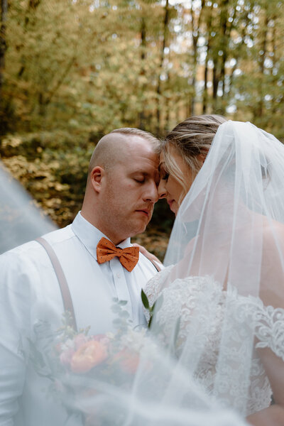 Intimate bride and groom portrait at summer elopement.