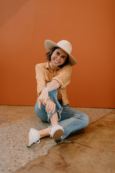 woman smiling while sitting