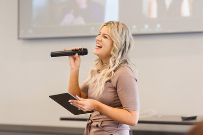 Woman with a microphone laughing