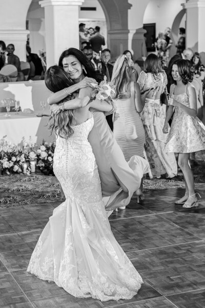 Phoenix-Wedding-Photographer-and-Videographer-Wrigley-Mansion-Bride-hugging-friend-VosWed-2187