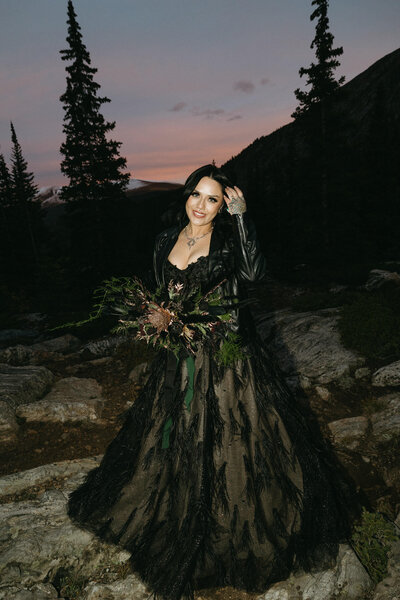 A couple in traditional wedding outfits getting married in a Cave in Colorado