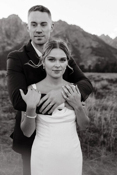 photo of bride and groom embracing while standing outside taken by Elopement photographer Jackson Hole WY