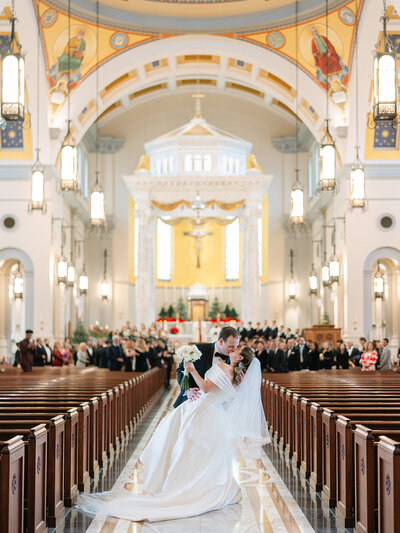 A married couple wiping away tears during their wedding ceremony