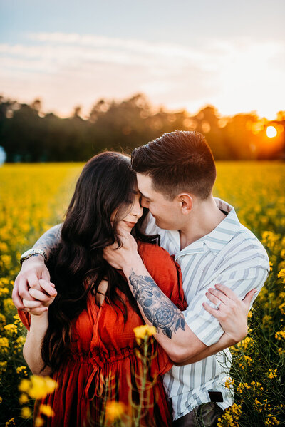 a couple embracing in a field of wildflowers