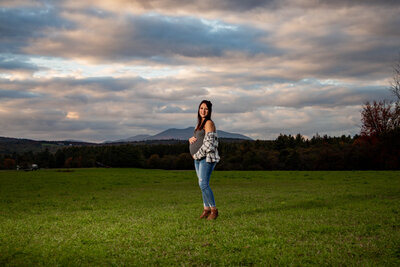 Maternity Photo of Mom in Field with Mountain Horizontal Photo