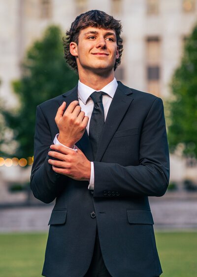 Senior Boy Adjusting Sleeve