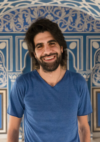 man standing in blue v neck t shirt