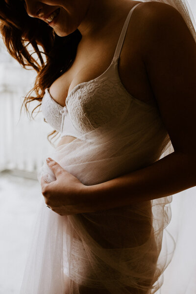 Woman posing for boudoir photo in Italy