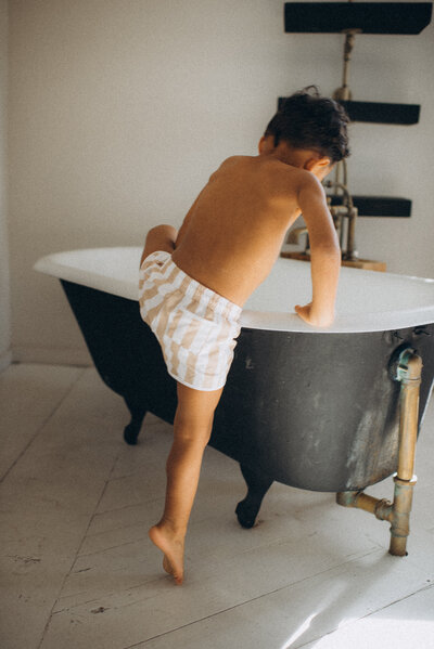 A child climbing into a tub in Scottsdale, Arizona