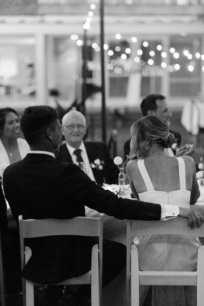 candid wedding reception moments with bride and groom
