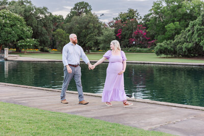 mom holding dad's hand at Hampton park