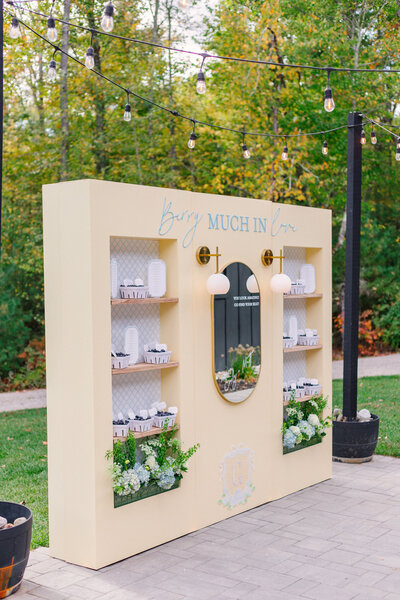 ‘Berry Much In Love’ wedding seating chart with blueberry baskets and table assignments, handcrafted by Cove Mill Design Co. in Southern Maine.