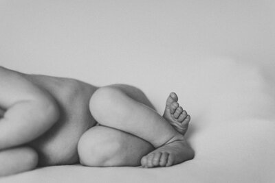 Black and white image of newborn baby's feet