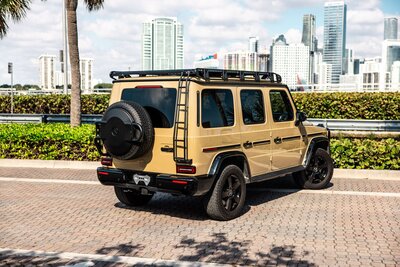 mercedes-g550-desert-sand-professional-edition-for-rent-in-miami-rear-quarter-view-013