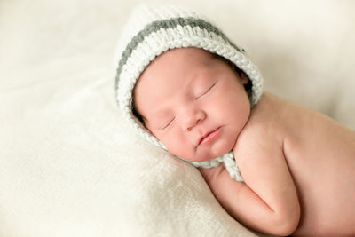 Newborn sleeping while in photo studio.