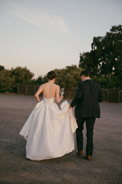 photo of bride and groom walking away from photographer taken by Philadelphia wedding photographer