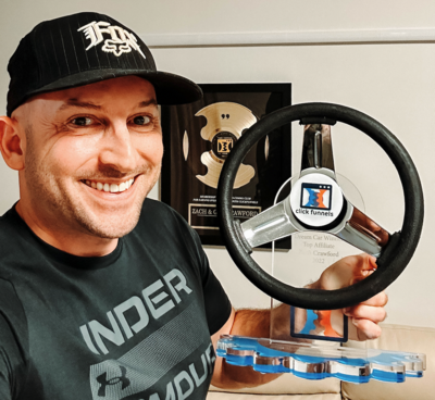 man holding an award