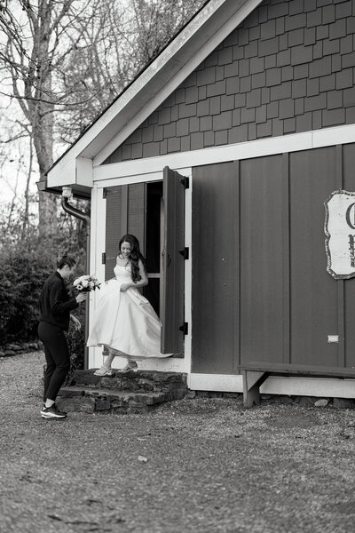 Rebecca Schwartz helping a bride down a set of stairs