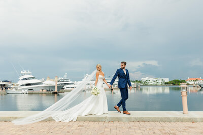 Bride and Groom walking on the pier in Palm Beach