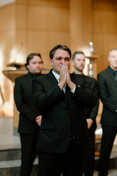catholic groom crying as his bride walks down the aisle