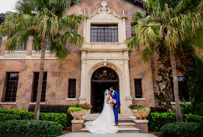 couple kissing under historic building