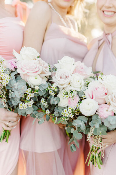 close up photo of bridesmaid's florals