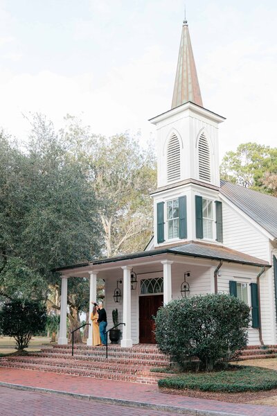 Parents-to-be on the steps of a chapel for Palmetto Bluff Photographer Lamp and Light Photography.