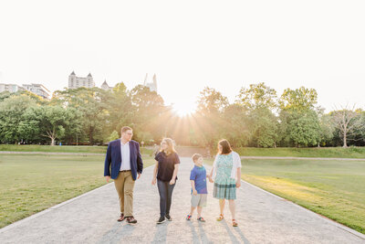 Photo of an engaged couple kissing at Historic Fourth Ward Park in Atlanta Georgia.
