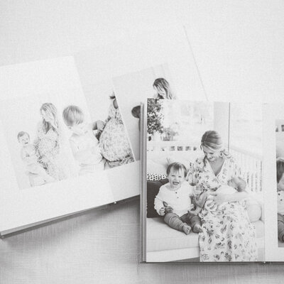 Close-up of linen photo album with soft ribbon, featuring timeless, fine art design