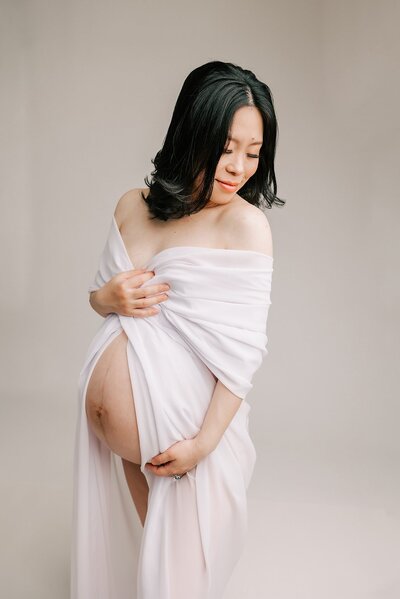 mom in maxi maternity gown with flowers on it