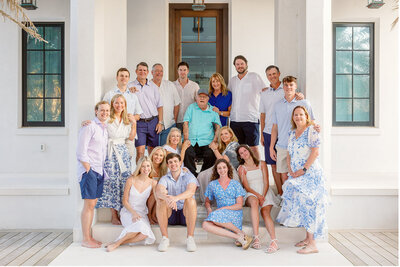 large family photo on steps of 30a home