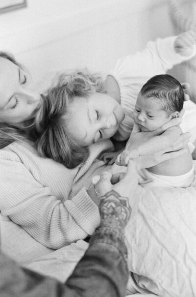 A tender scene from a maternity session in Sydney by Tealily at Palm Beach