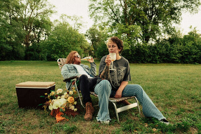 couple sitting on lawn chairs enjoying drinks captured by wisconsin photographer