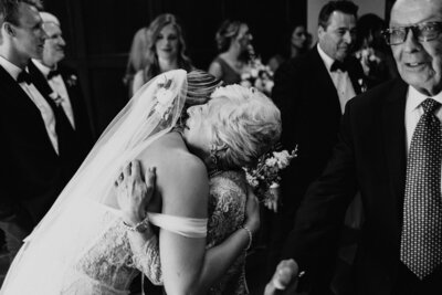 Bride hugging grandma at University of Michigan luxury wedding