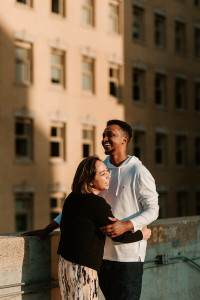 couple laughing in the setting sun 