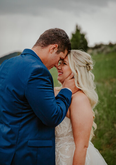 Portrait of bride and groom smiling at each other after their Ennis, Montana Elopement
