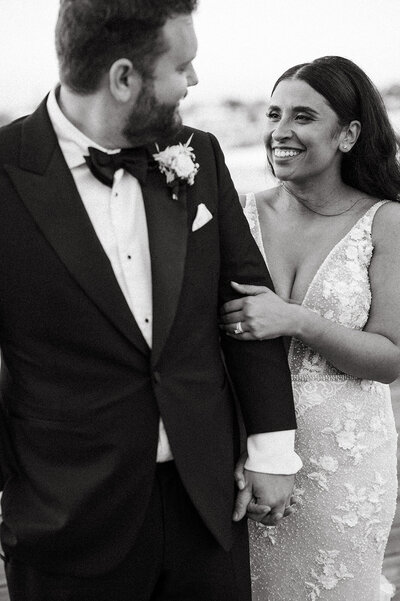 This black and white photo by a Washington wedding photographer captures a bride and groom in a joyful, unguarded moment, their smiles as bright as their future.