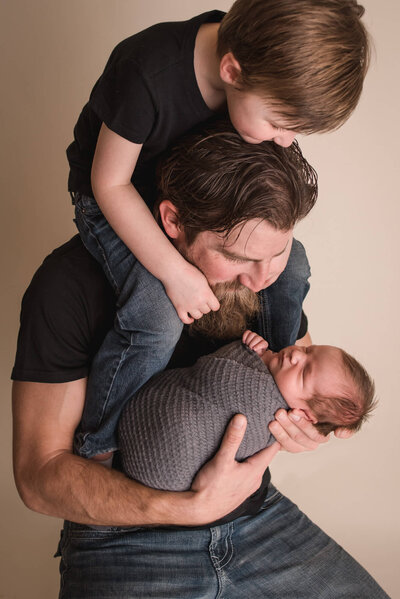 Fond du Lac Newborn Photo Session dad and baby brother in studio | Glory Be Photography by Tara Bos