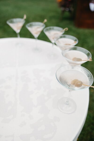 Martini glasses with olives at New England wedding