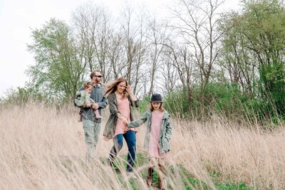 A family captured by Krop Kreative during a nature hike session—Lake Geneva lifestyle photography.