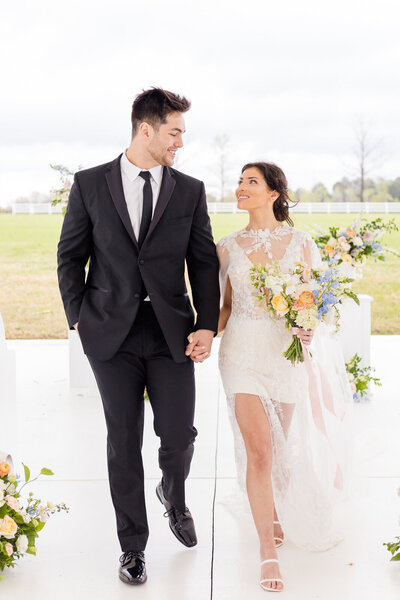 Newlyweds walking down the aisle