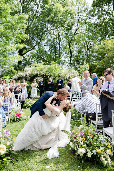 Bride and groom dipping during wedding ceremony in Ohio captured by The Cannons Photography