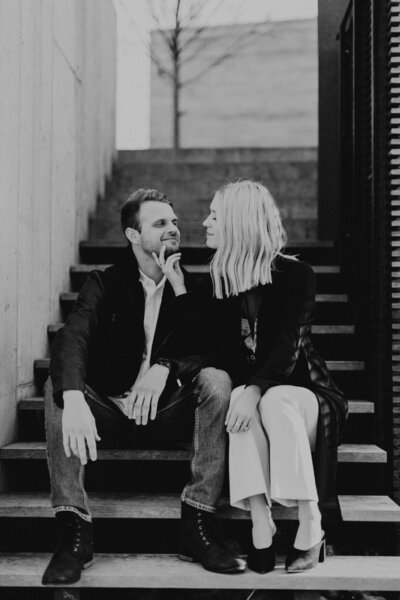 Detailed shot of Catherine and Kevin's engagement rings with Charlottesville scenery in the background