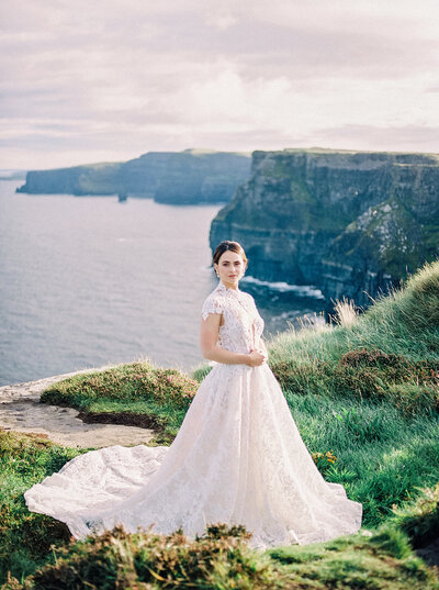 A beautiful bridal portrait set against a stunning coastal backdrop at The Resort at Pelican Hill, capturing the elegance and sophistication of a luxury California wedding by Tiffany Longeway Photography.