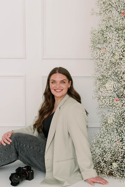 Raechel posing against a wall inside Honeytree Studio in Kalamazoo, Michigan during her branding session.