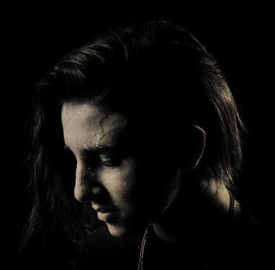 musician portrait closeup on black background Dominique Ilie